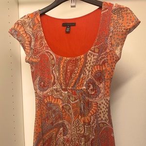 Flattering baby doll style stretchy top.